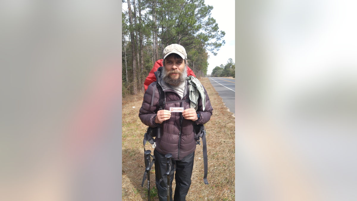 Mostly Harmless photo: Vance Rodriguez, holding a small hiker card.