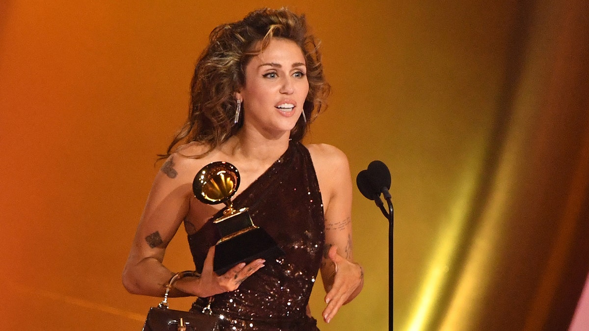 Miley Cyrus accepts Grammy award