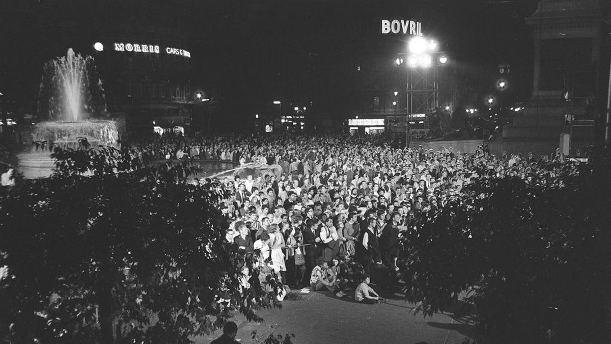 People gathered to watch the moon landing and walk in 1969. 