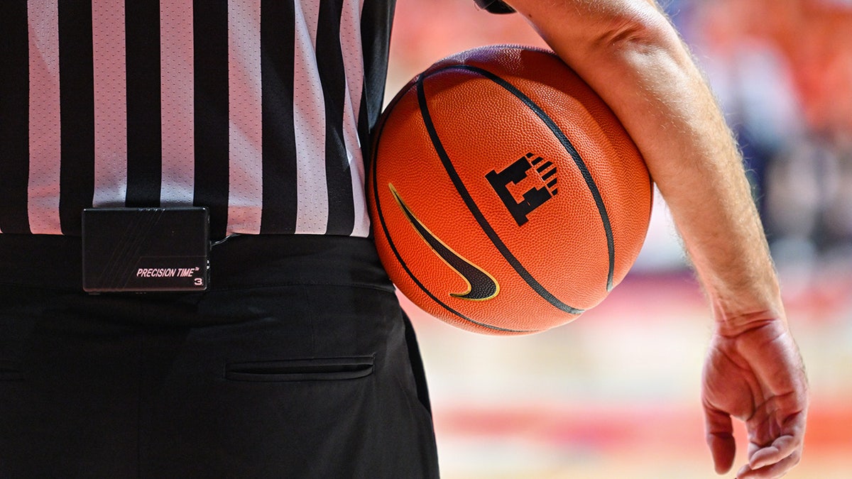 A referee with a basketball