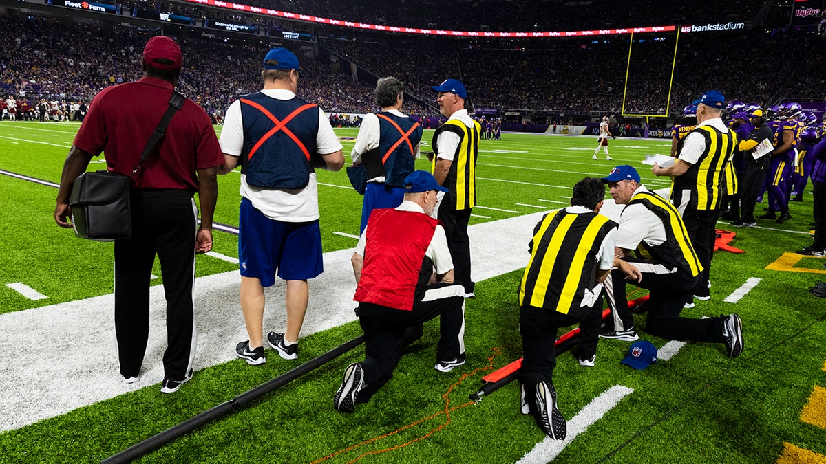 A view of ball boys and the chain crew during an NFL regular season football game between the Washington Redskins and Minnesota Vikings on Thursday, Oct. 24, 2019 in Minneapolis.