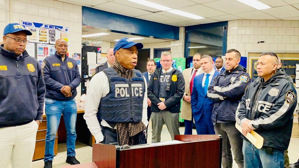 NYC Mayor Eric Adams wears Fendi scarf under bulletproof vest