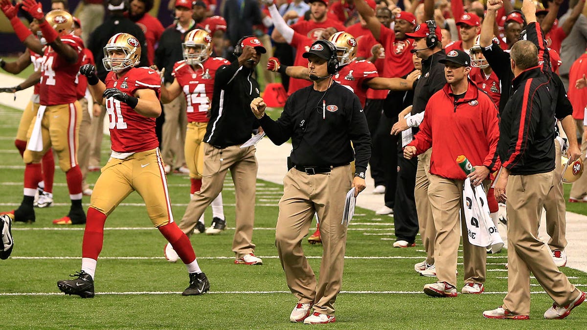 Jim Harbaugh reacts during a game