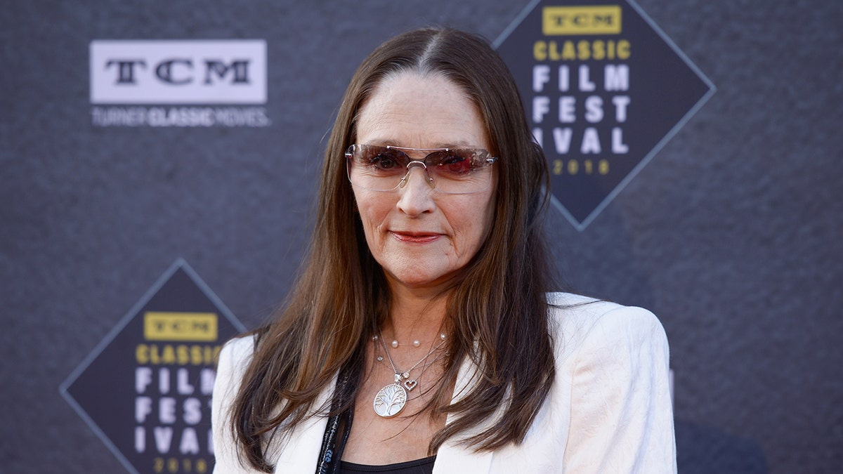 Olivia Hussey wearing sunglasses on the red carpet