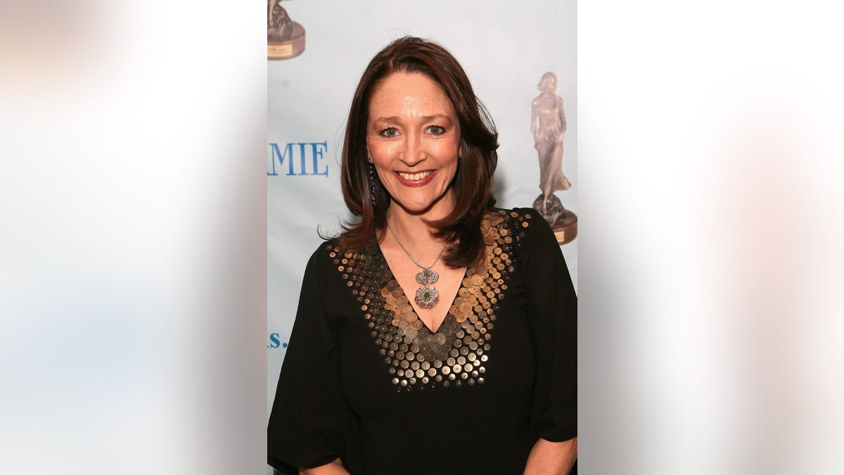 Close up of Olivia Hussey smiling on the red carpet