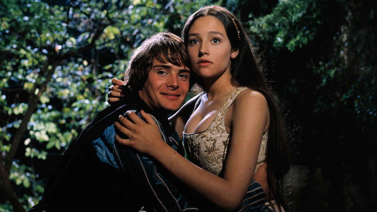 Leonard Whiting and Olivia Hussey hugging in a scene from Romeo and Juliet