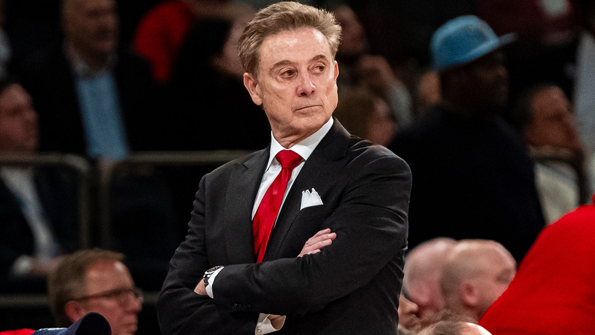 Rick Pitino walks the sideline