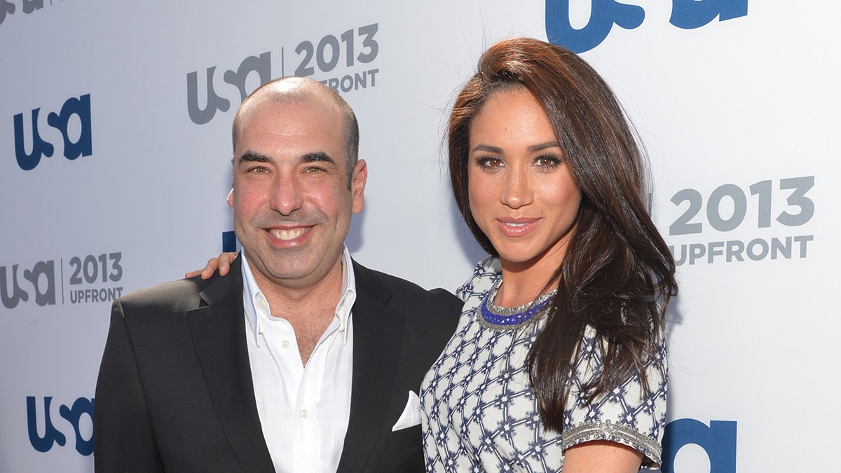 Rick Hoffman and Meghan Markle posing together on the red carpet
