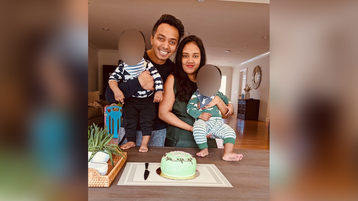 Anand Sujith Henry, left, with his wife, Alice Benzinger, right, and their two kids.