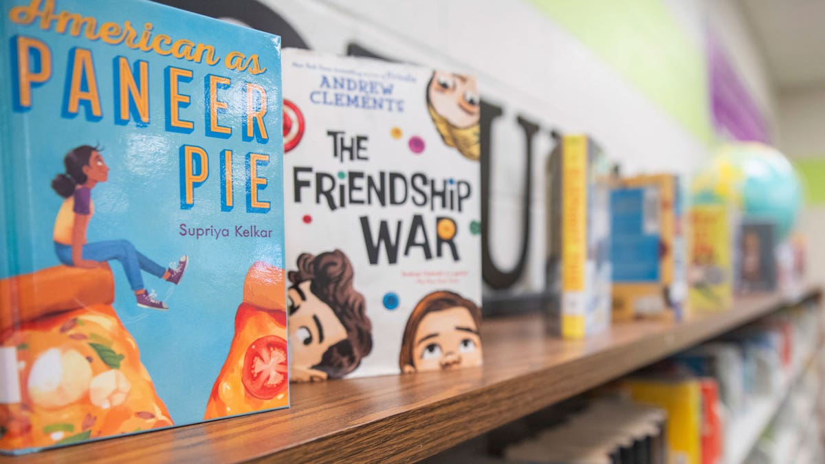 Books sit on shelves in an elementary school library in suburban Atlanta
