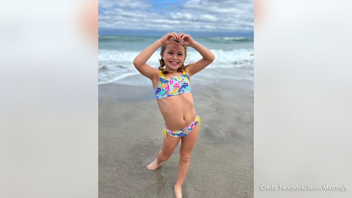 An image of Sloan Mattingly, 7, on the beach. She died when a sand hole collapsed on her.
