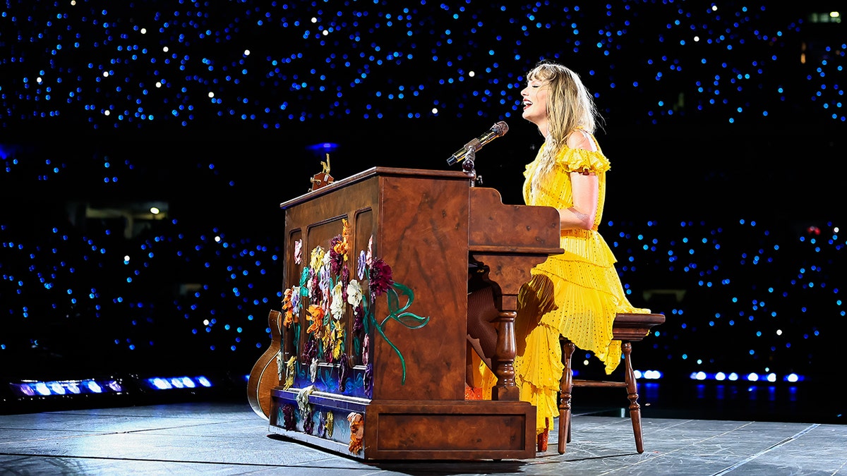 Taylor Swift playing piano on Eras Tour
