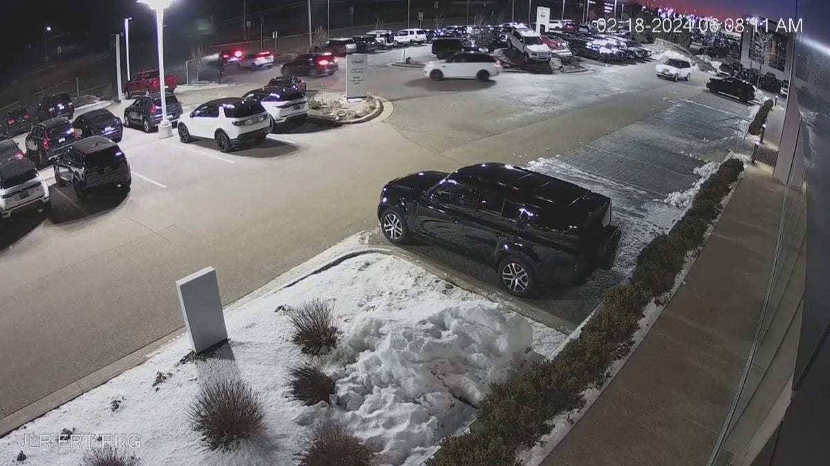 cars driving away from dealership