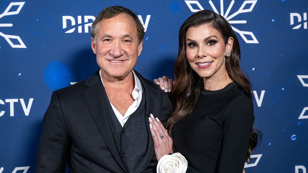 Terry Dubrow and Heather Dubrow posing together