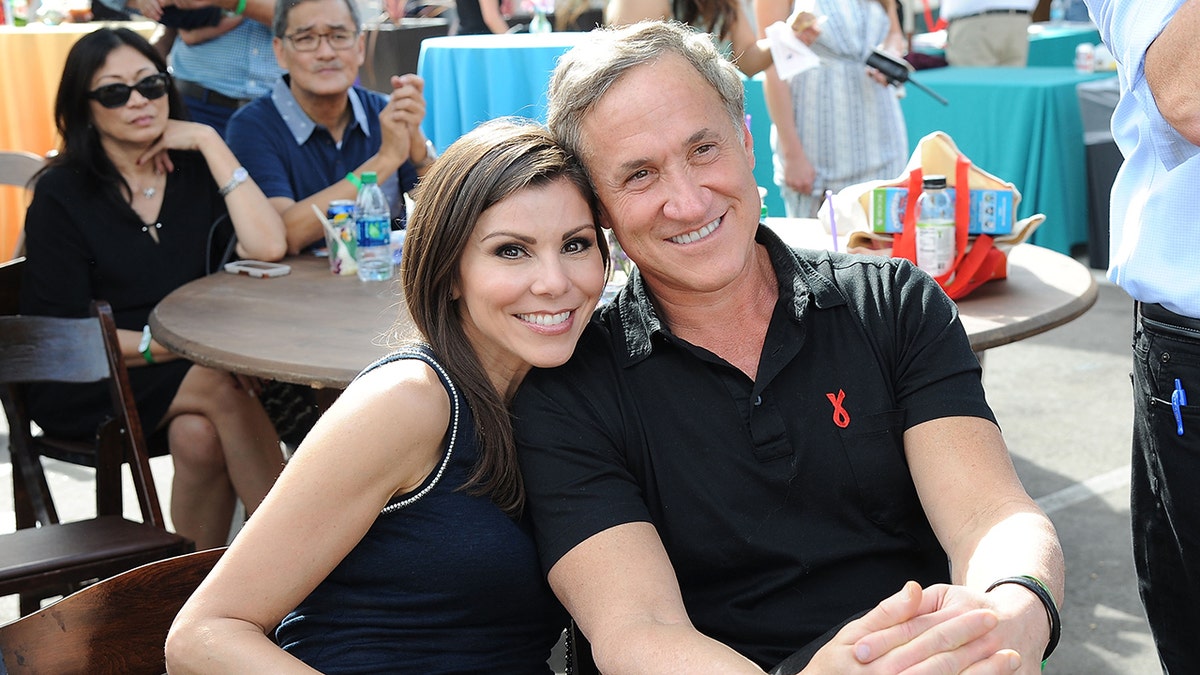 Heather Dubrow leaning her head on Dr. Terry Dubrow's shoulder