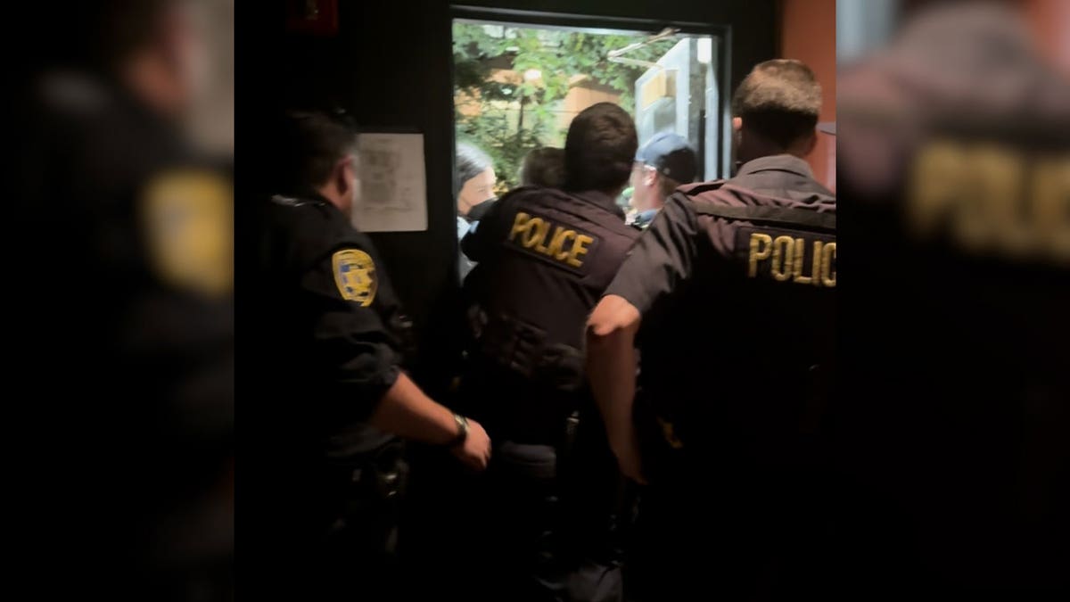 Police confront protesters as they break through door on UC Berkeley's campus