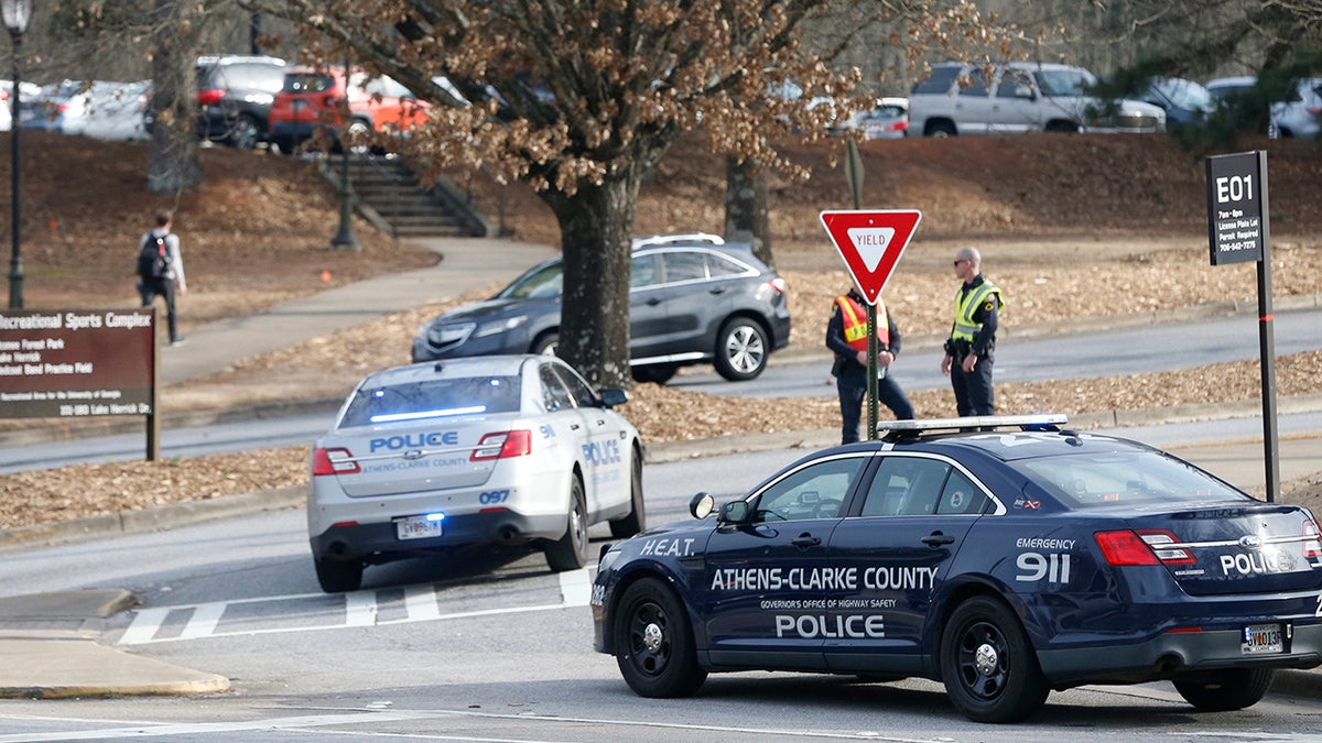 Athens-Clarke County police block traffic and investigate at the UGA intramural Fields after the body of a women was found