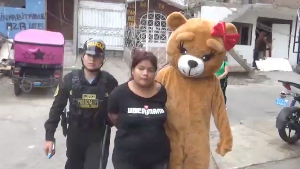 An undercover police officer dressed as a bear with a box of chocolates and a Valentine lures a drug dealer out of her home