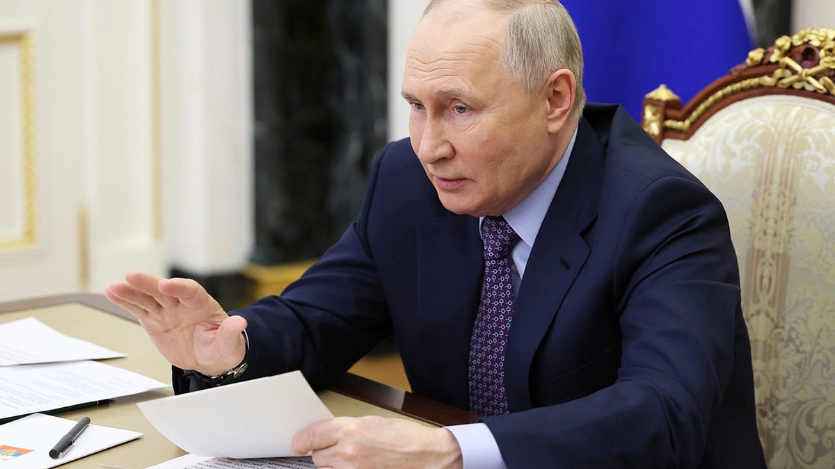 Vladimir Putin at desk