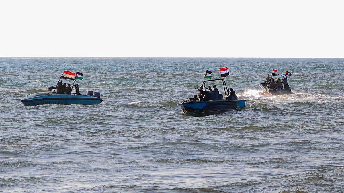 Members of the Yemeni Coast Guard affiliated with the Houthi group patrol the sea