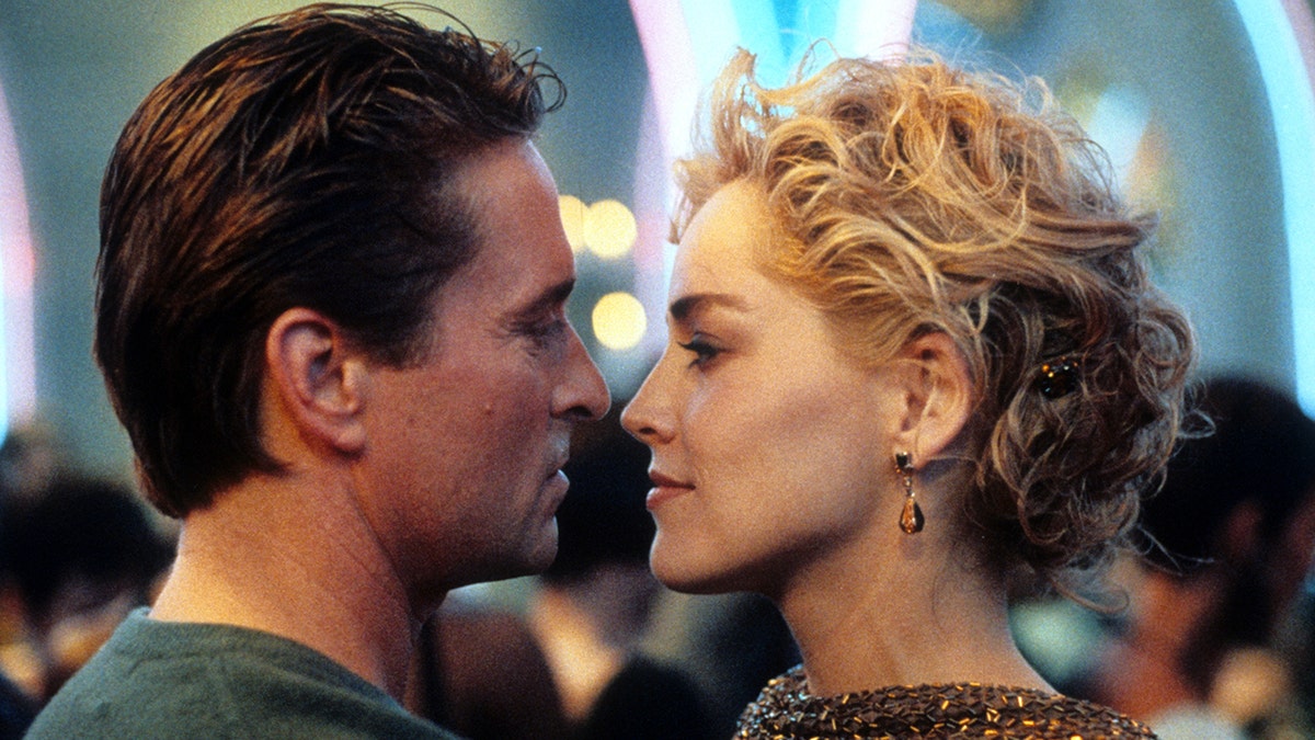 Michael Douglas and Sharon Stone look longingly at each other during a scene from "Basic Instinct"