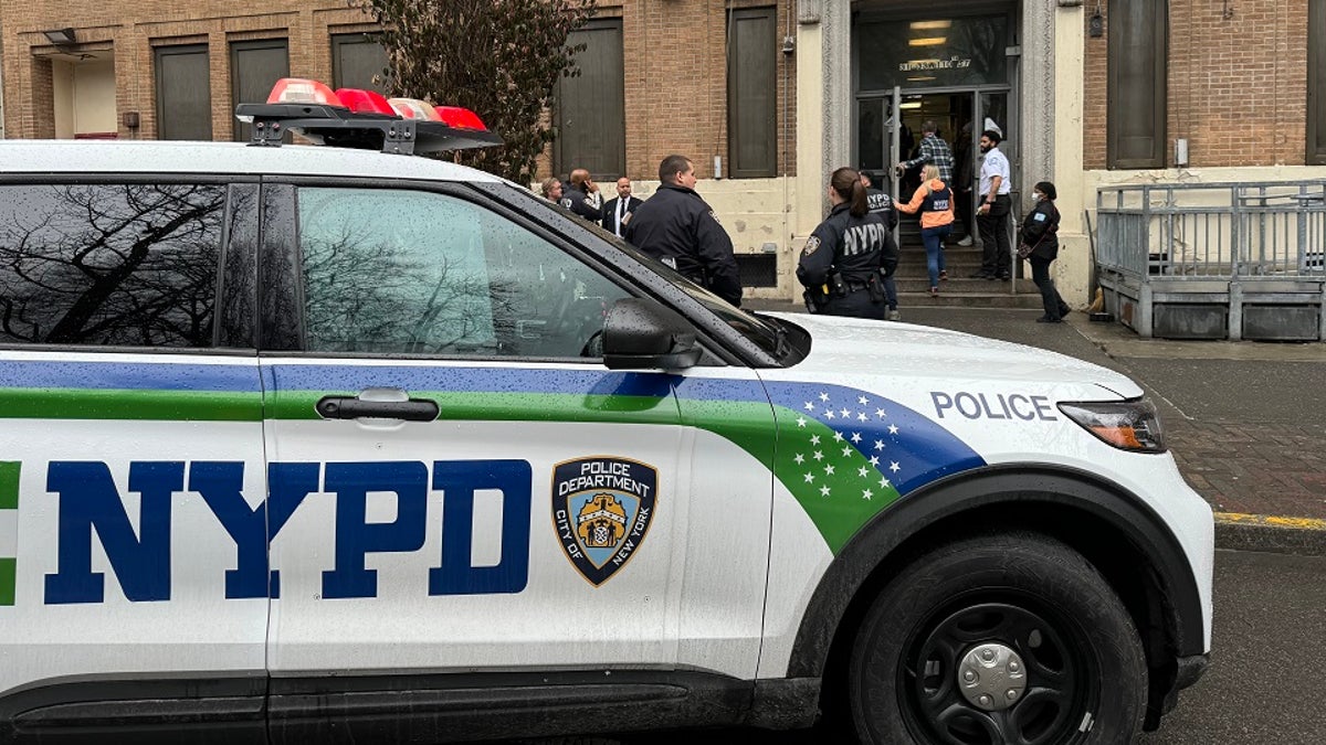 NYPD car outside migrant shelter