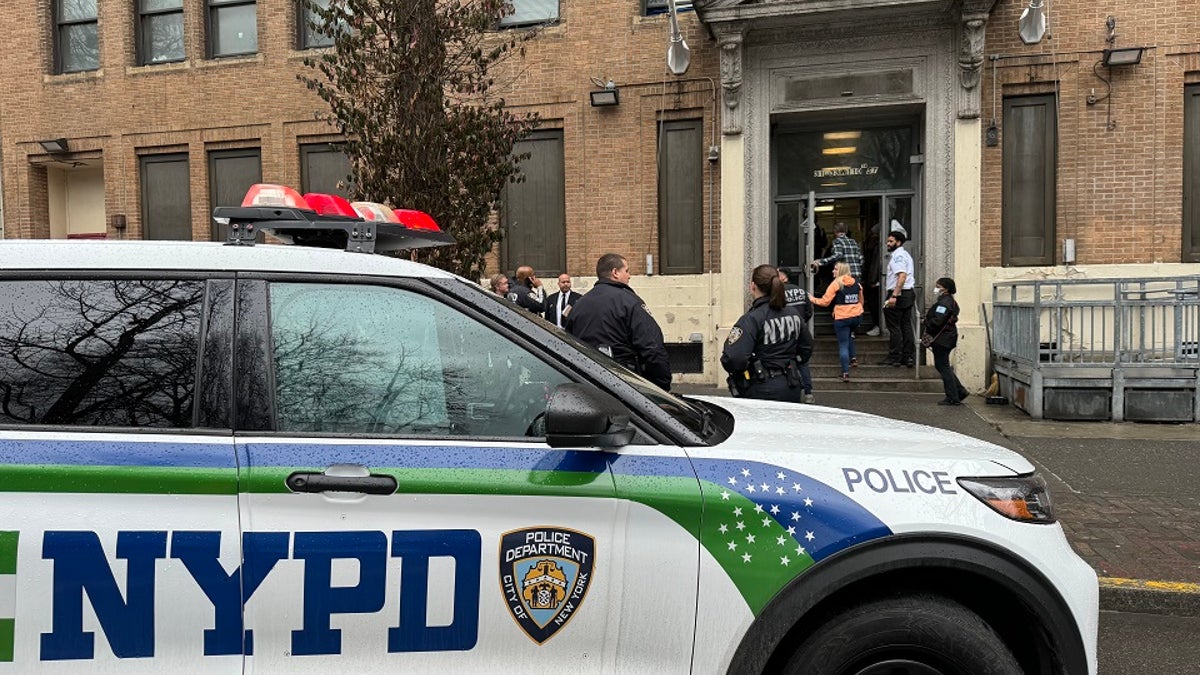 NYPD car outside migrant shelter