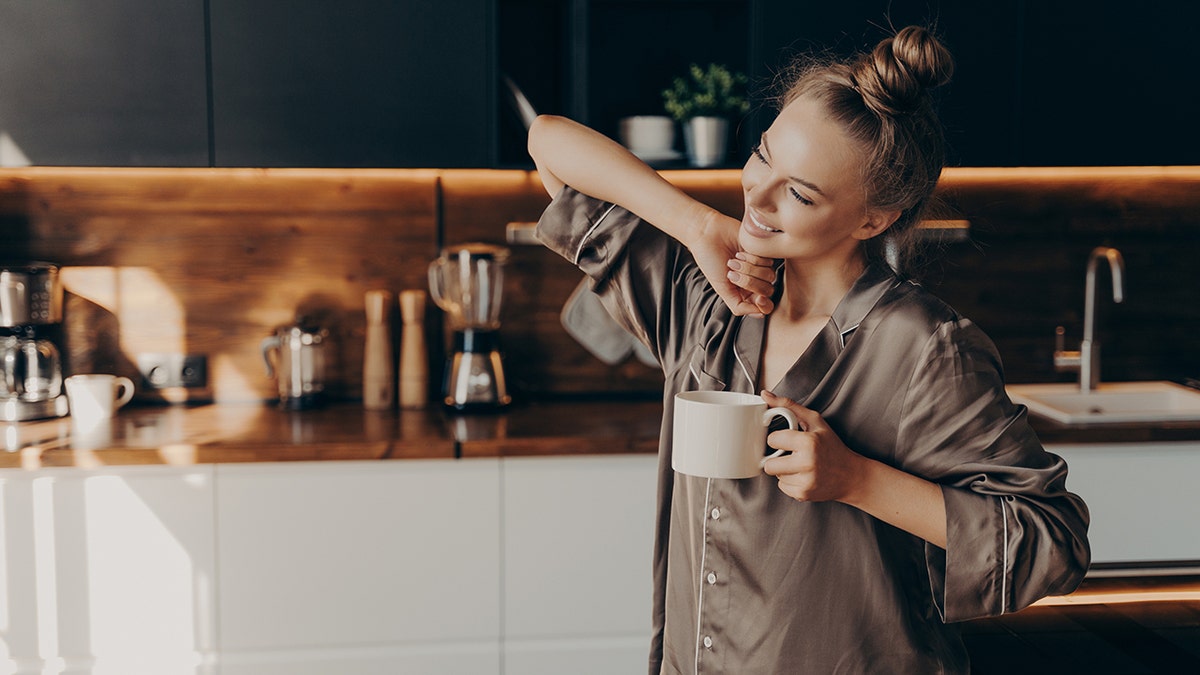 woman drinks coffee in the morning