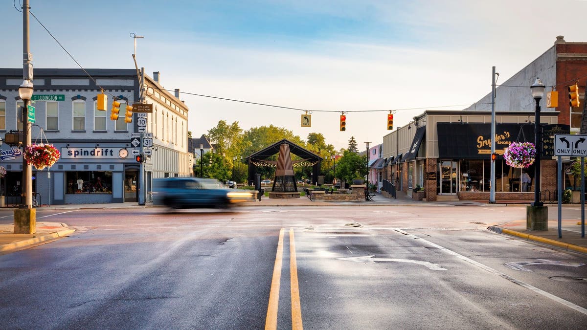 Car speeds through intersection in downtown Ludington, Michigan