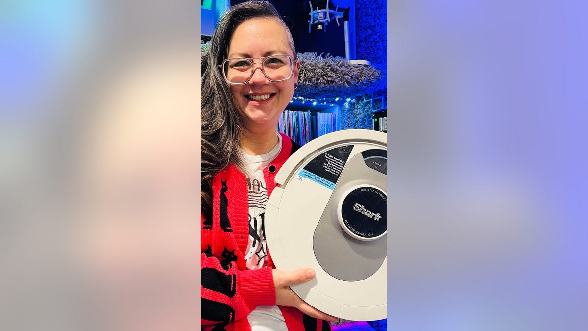 Woman holding robot vacuum