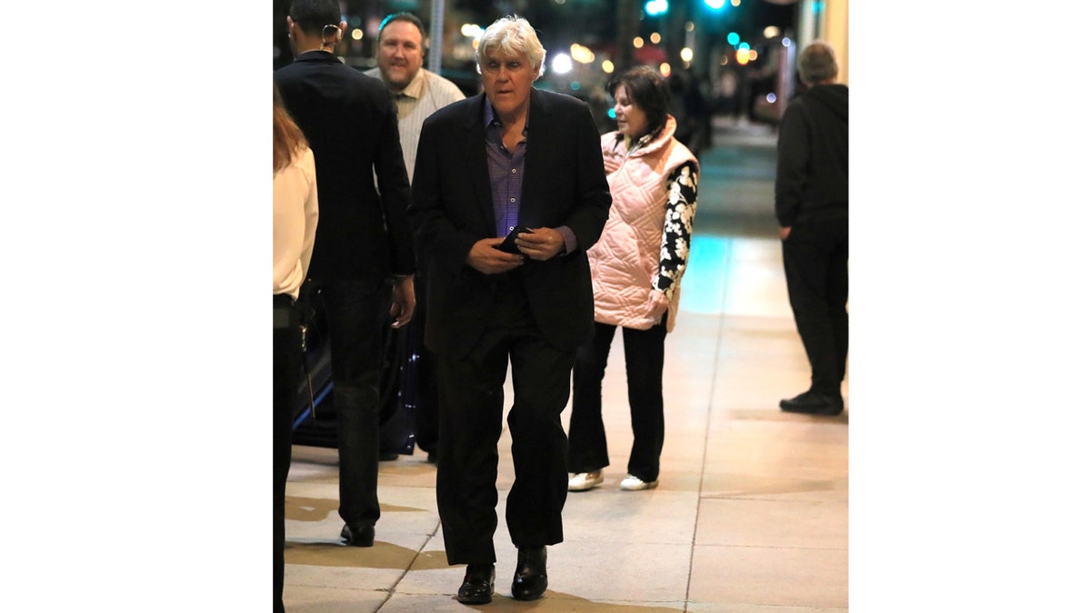 Jay Leno walks to his car following date night with wife Mavis