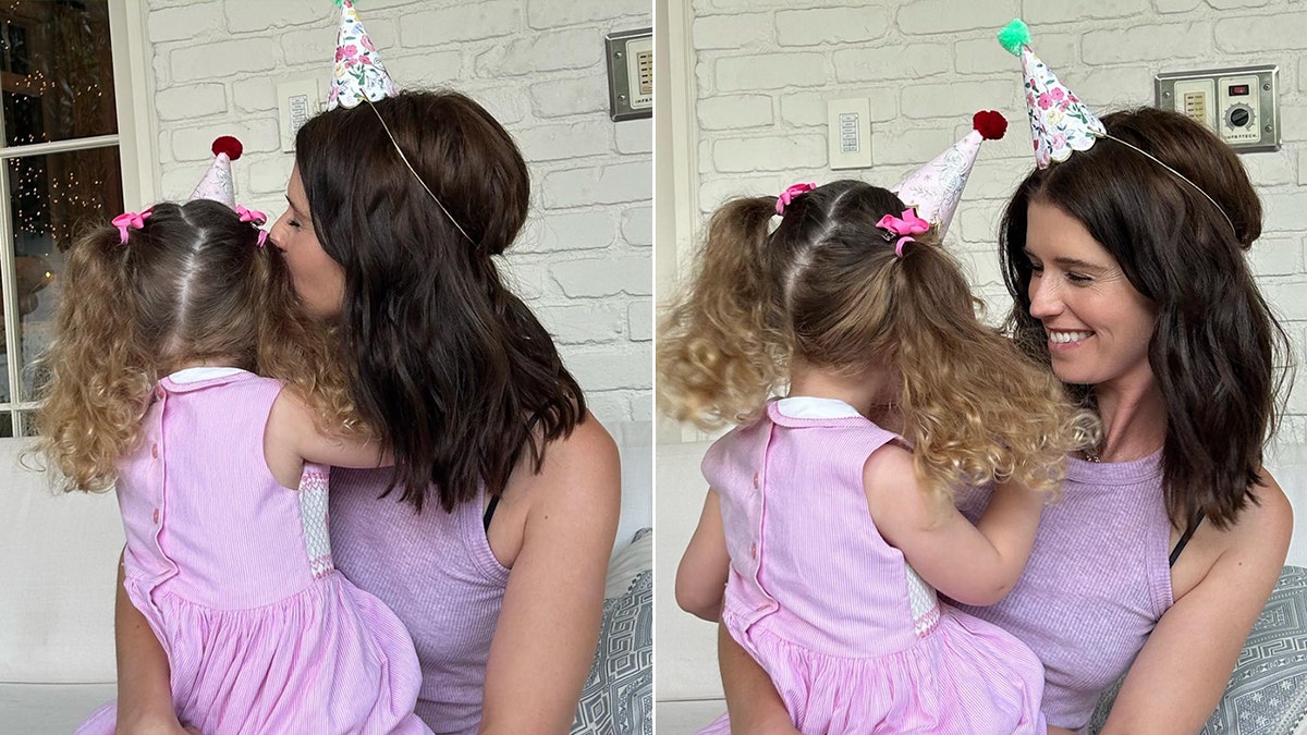 Katherine Schwarzenegger holds her daughter Lyla and kisses her face split she laughs with Lyla