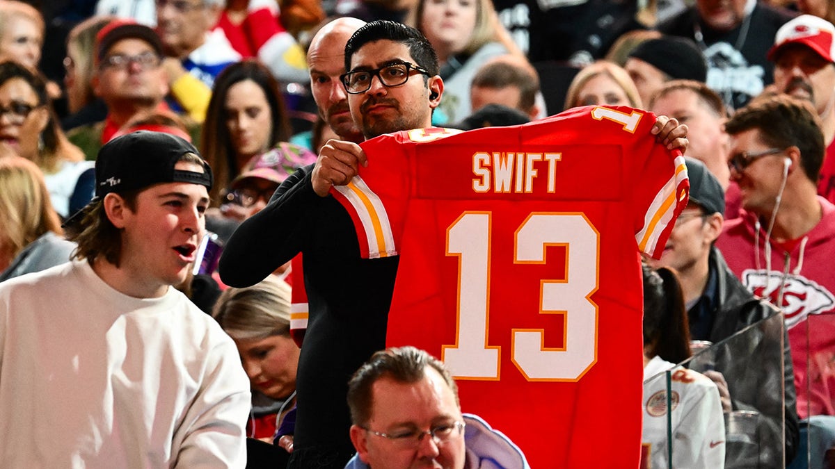 Fan holds up Swift Chiefs jersey