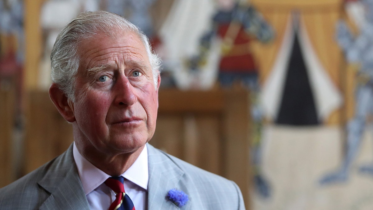 King Charles looking somber