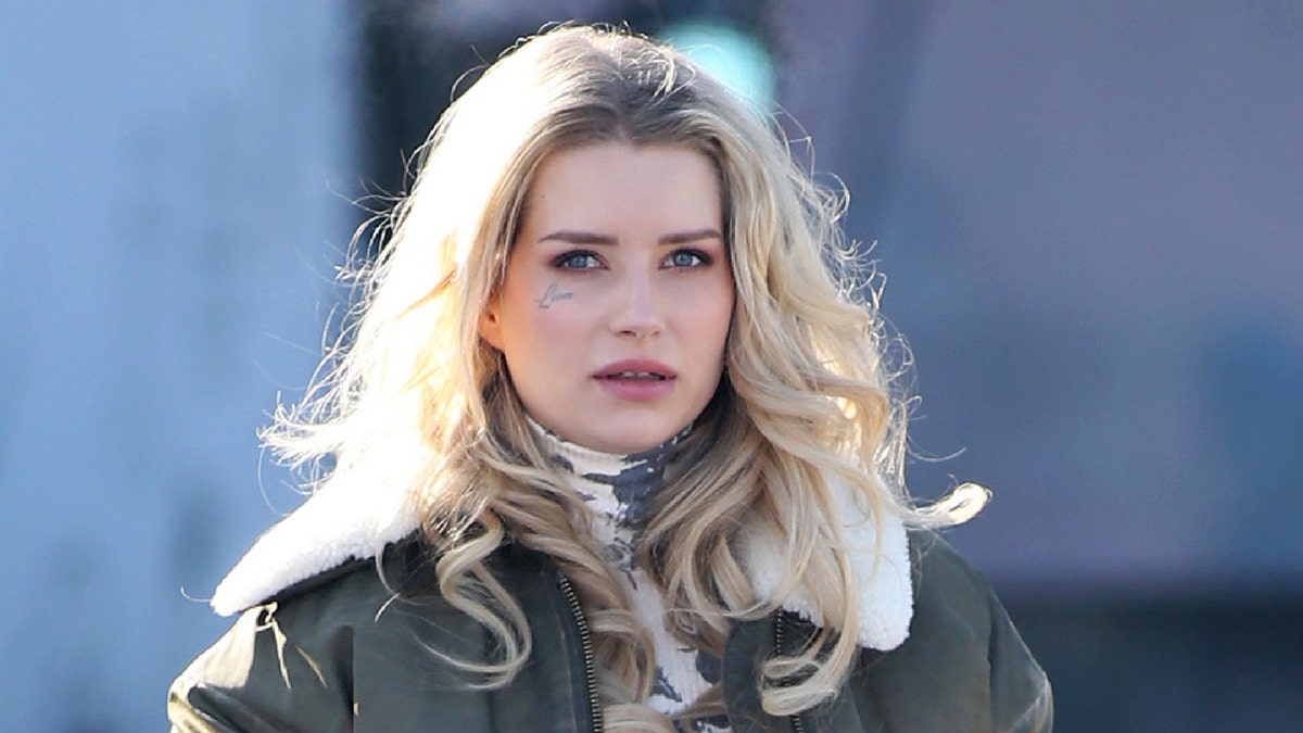 Lottie Moss stays warm wearing green winter coat