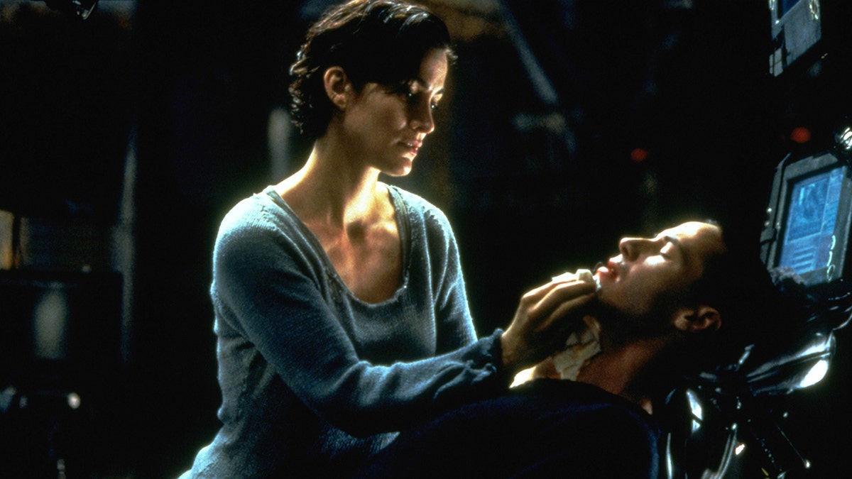 Carrie-Anne and Keanu Reeves in "The Matrix"