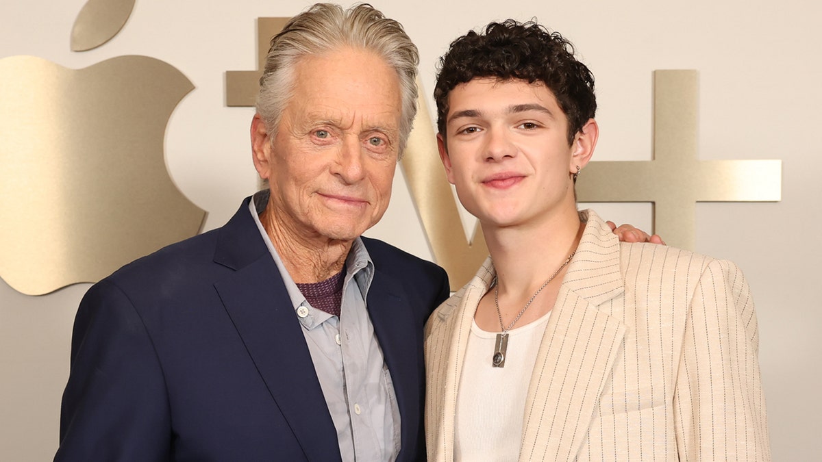 Michael Douglas and Noah Jupe decorating