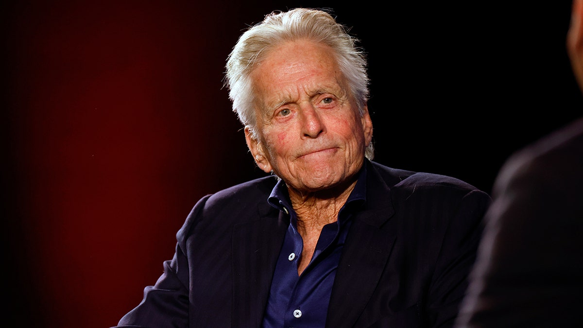 Michael Douglas in a red chair