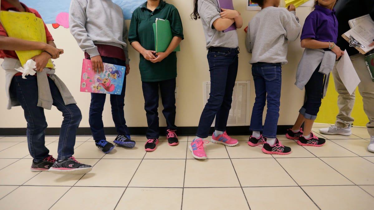 Migrant kids standing