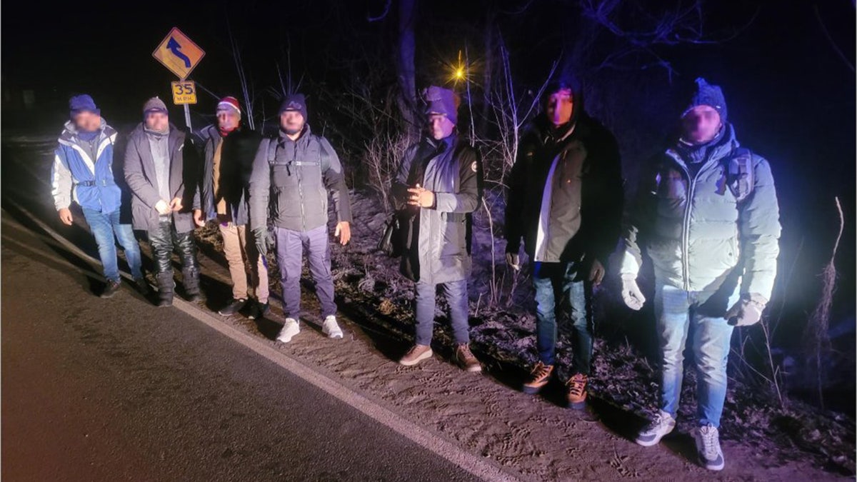 Group of migrants with their faces blurred found in Champlain, N.Y. after crossing the border illegal