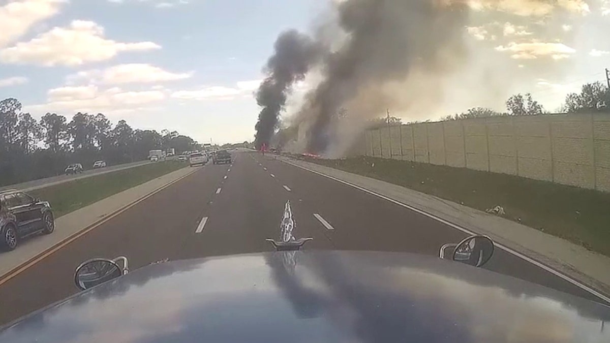 smoke billowing from crash site