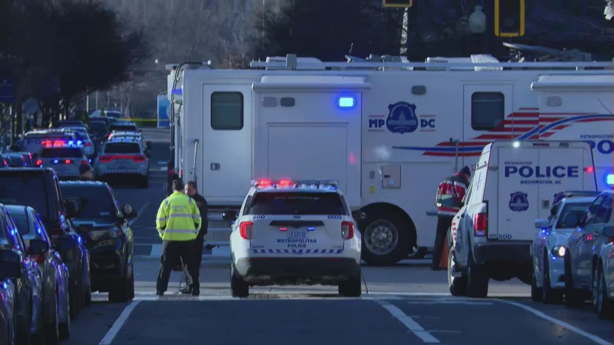 Police and EMS vehicles report to scene of an officer-involved shooting in Washington, D.C.