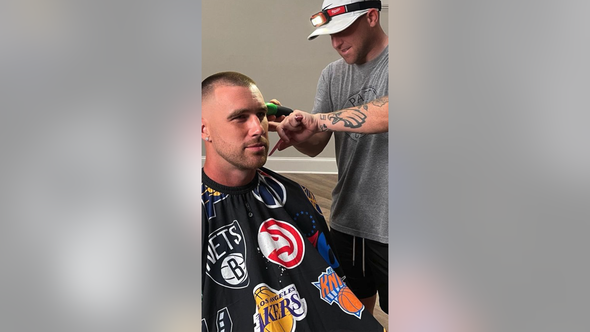 Regan cutting Kelce's hair