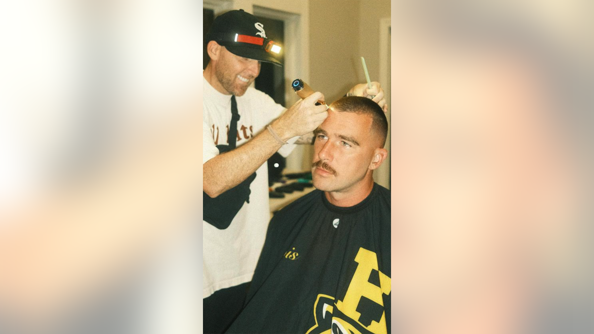 Regan cutting Kelce's hair