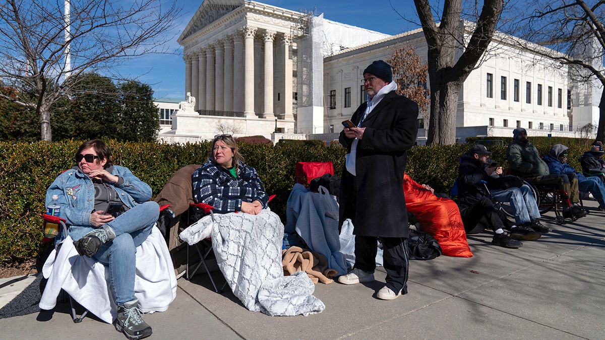 People line up outside the U.S. Supreme Court building