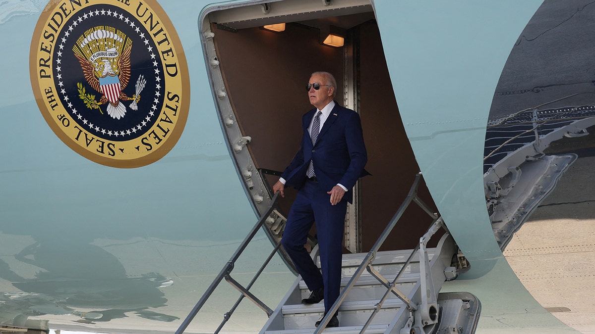 President Biden descends stairs from Air Force One