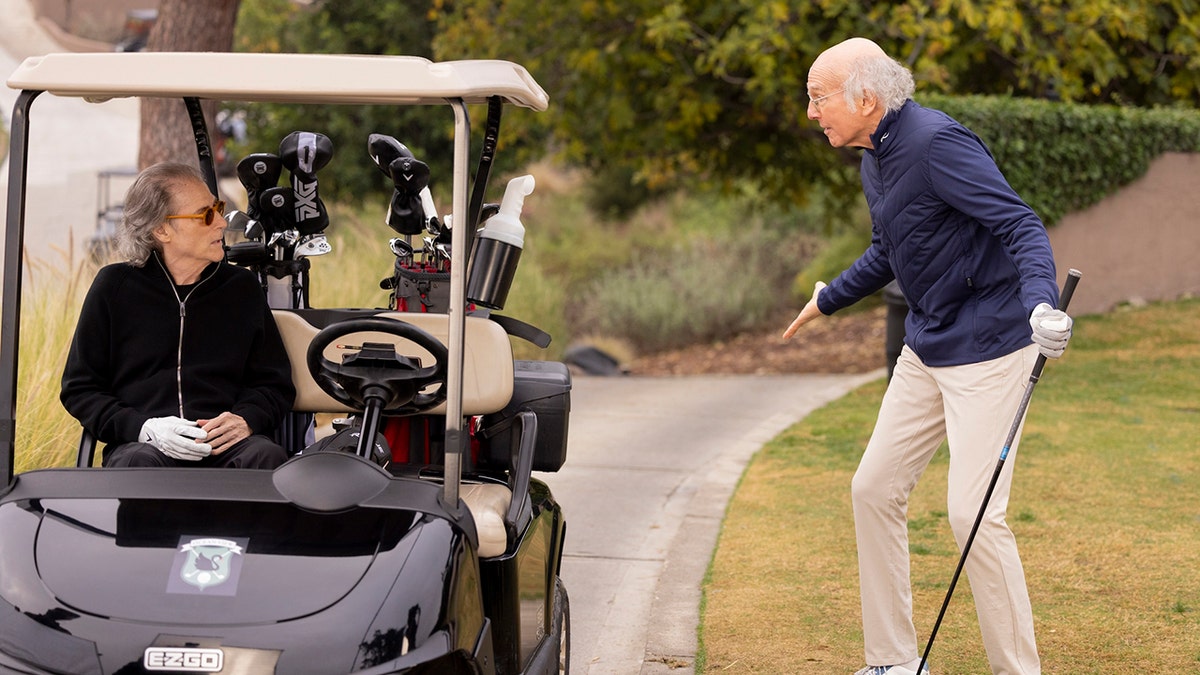Richard Lewis and Larry David on a golf course in a scene from Curb Your Enthusiasm
