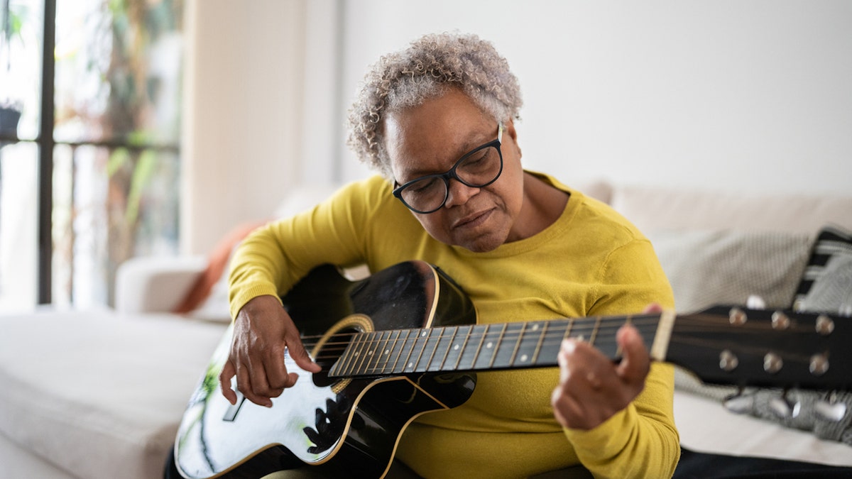 Woman playing guitar