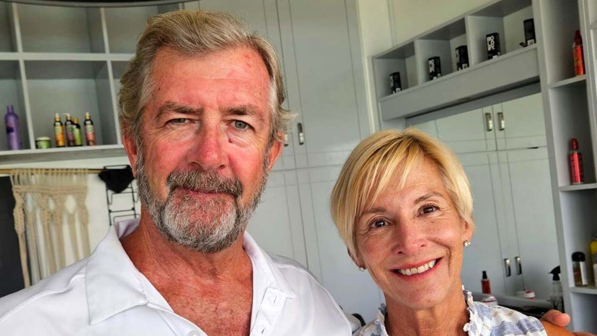 Ralph Hendry and Kathy Brandel smiling in a photo