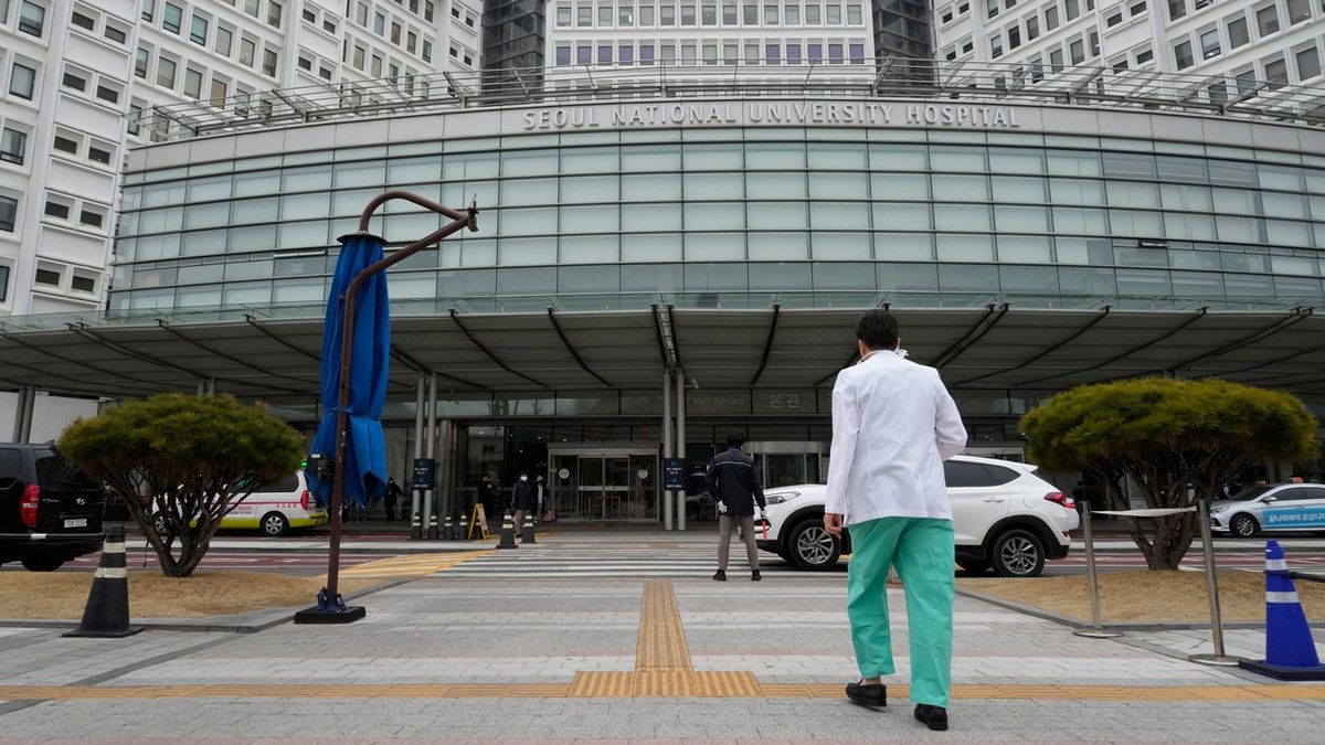 A medical worker entering a South Korean hospital